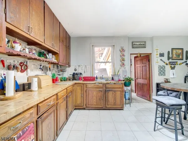a kitchen with stainless steel appliances a sink and cabinets