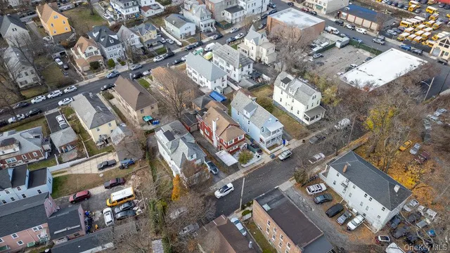 a view of a backyard with wooden fence
