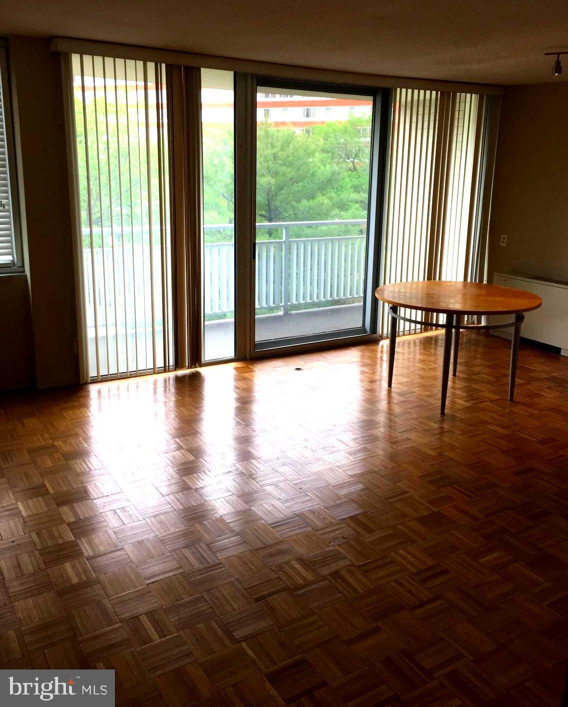 1301 South Arlington Ridge Road, Unit 203 Arlington, VA 22202 - Photo 11 of 31 Large patio door lets in lots of light and air