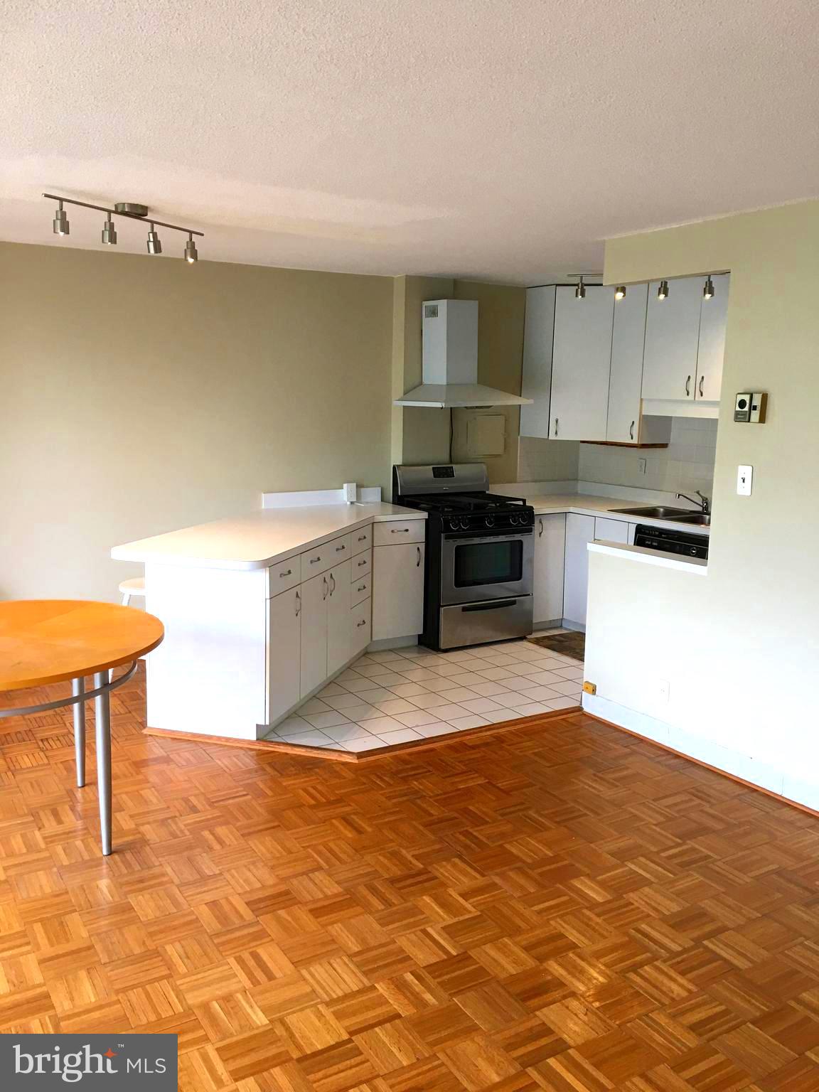 1301 South Arlington Ridge Road, Unit 203 Arlington, VA 22202 - Photo 16 of 31 Kitchen opens to dining/living room areas