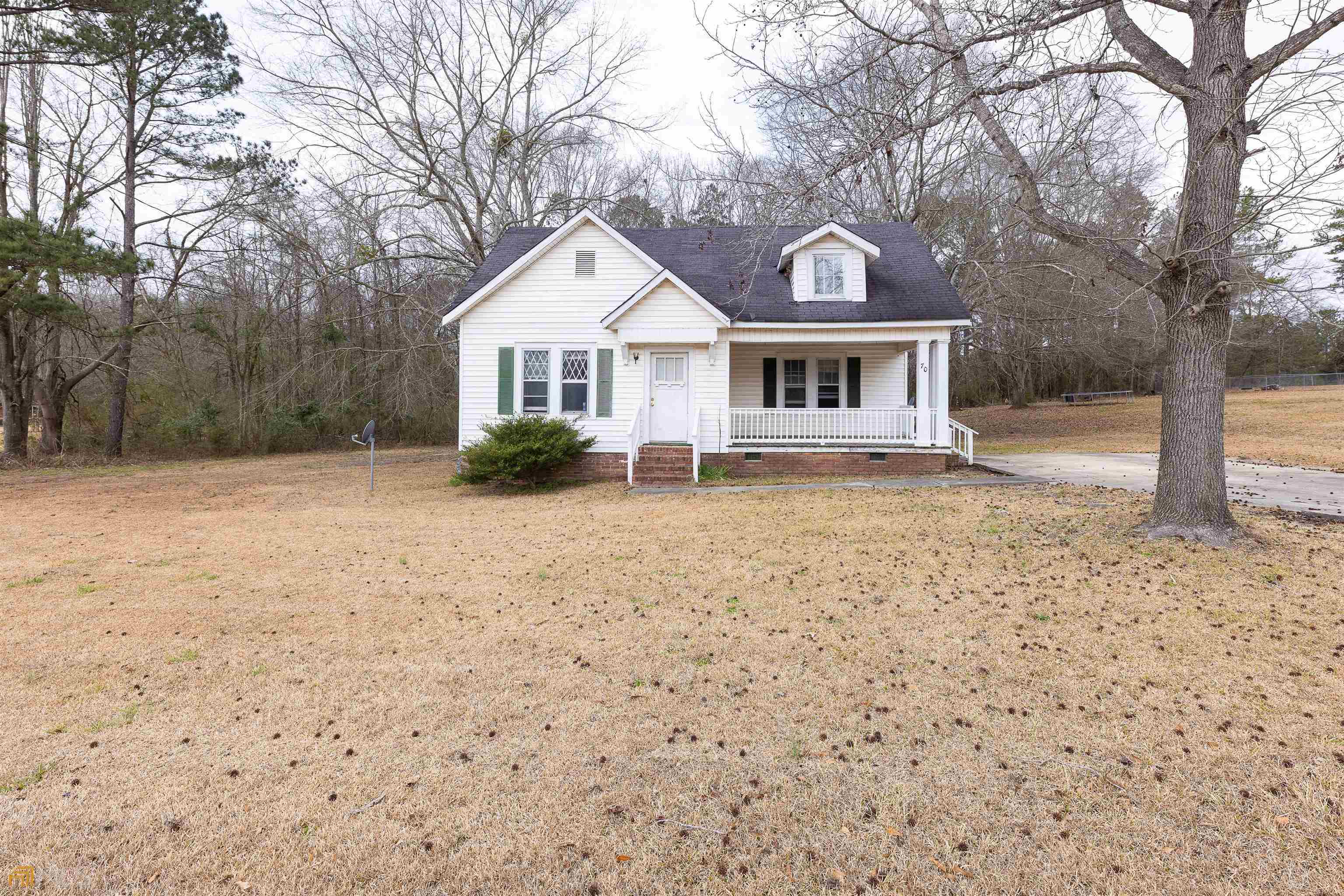 70 Fallin Street Thomaston, GA 30286 - Photo 1 of 1 a front view of a house with garden