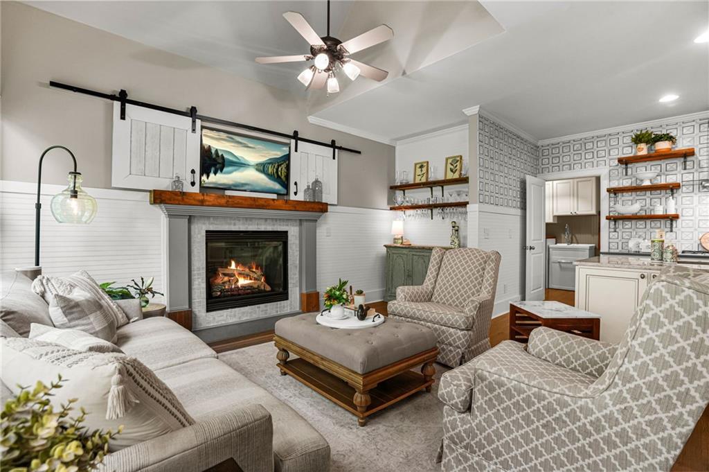 509 Crested Hawk Ridge Canton, GA 30114 - Photo 18 of 89 a living room with furniture and a fireplace