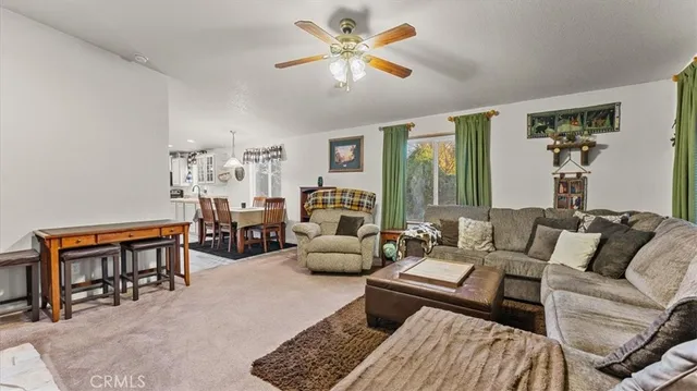 a living room with furniture a fireplace and a piano