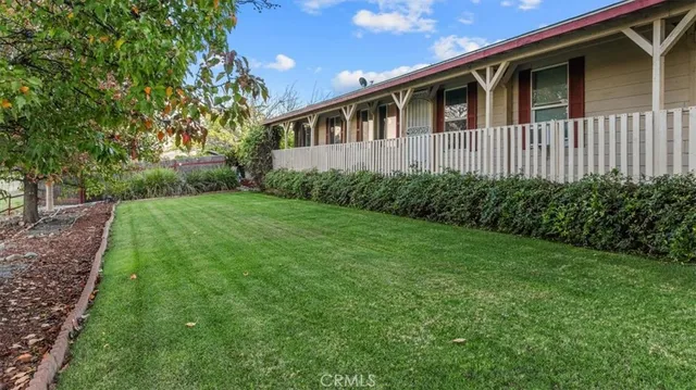 an aerial view of a house with a lake view