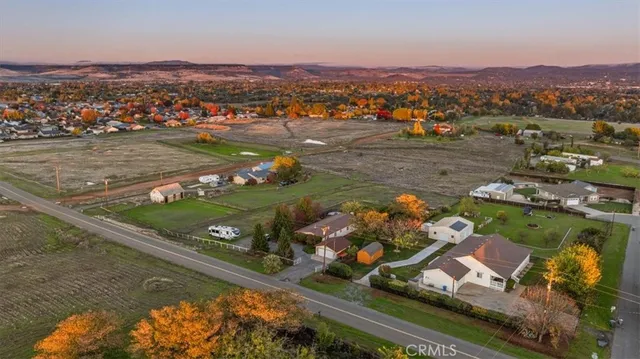an aerial view of a pool with a mountain view