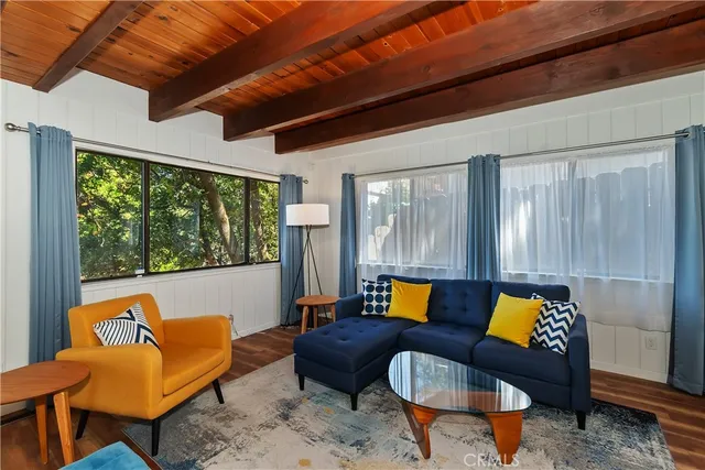 a view of a dining room with furniture wooden floor and chandelier