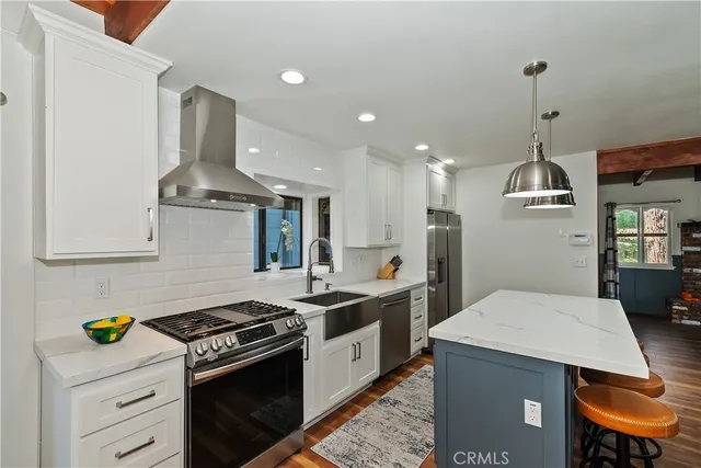 a living room with furniture a window and a fireplace