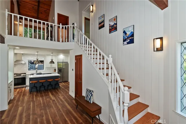 a bathroom with a double vanity sink mirror and shower