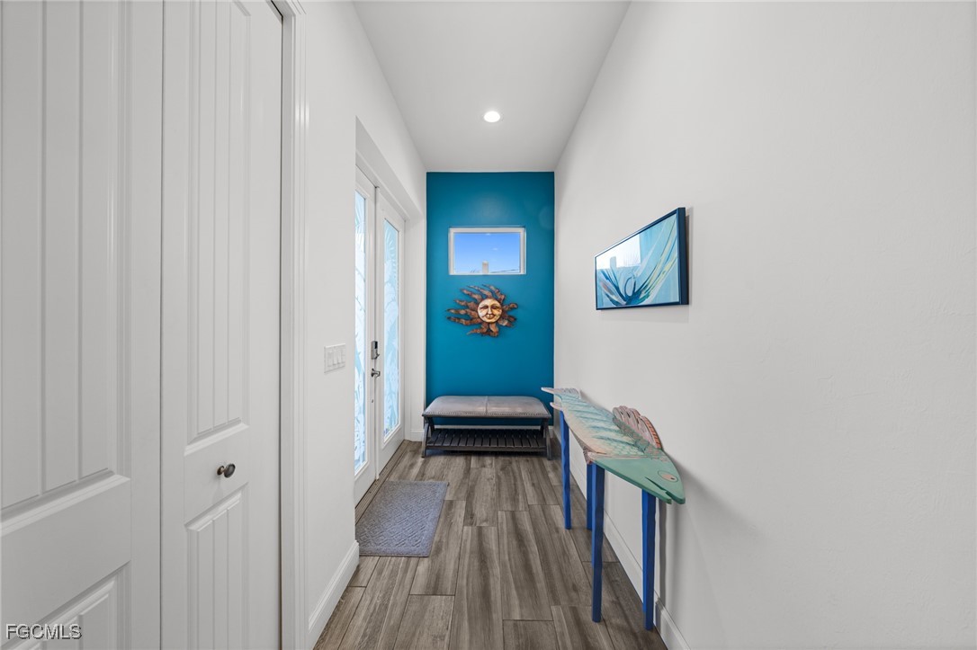 2743 Janet Street Matlacha, FL 33993 - Photo 14 of 45 a view of a hallway with wooden floor and staircase