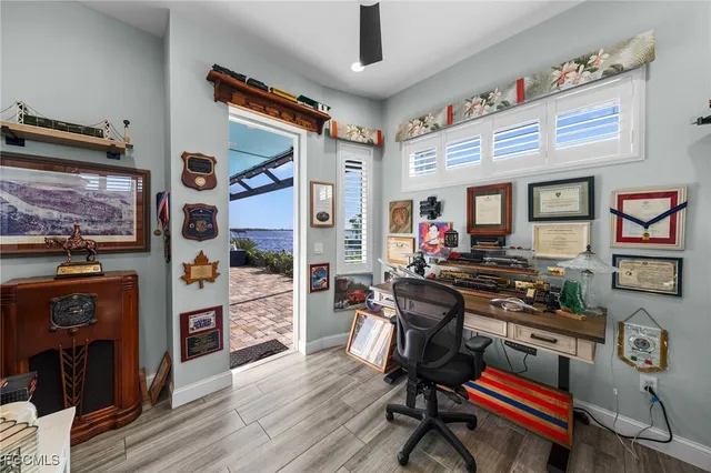 a workspace with furniture and wooden floor