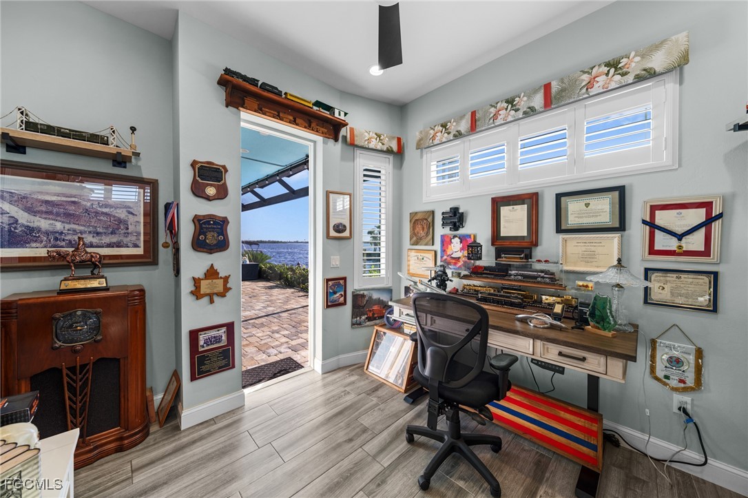 2743 Janet Street Matlacha, FL 33993 - Photo 28 of 45 a workspace with furniture and wooden floor