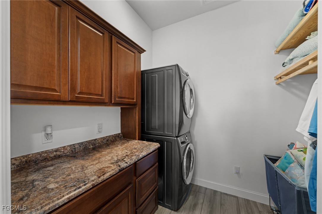 2743 Janet Street Matlacha, FL 33993 - Photo 30 of 45 a kitchen with a refrigerator and cabinets