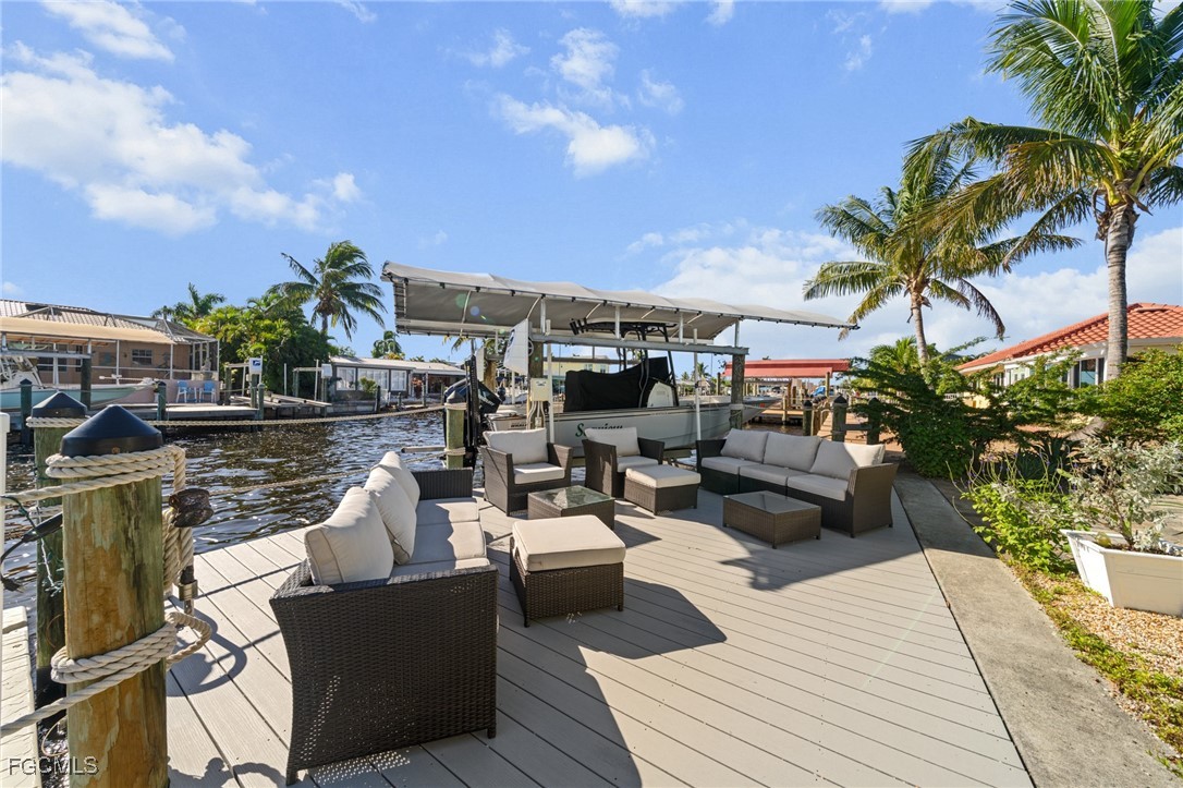 2743 Janet Street Matlacha, FL 33993 - Photo 37 of 45 a view of a roof deck with couches and potted plants