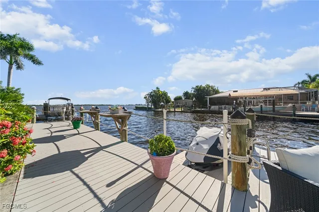a terrace with outdoor seating city view and ocean view