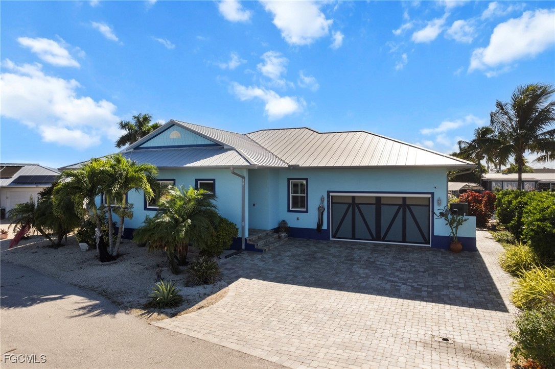2743 Janet Street Matlacha, FL 33993 - Photo 41 of 45 a front view of a house with garden