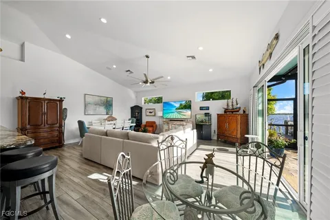 a living room with fireplace furniture and a flat screen tv