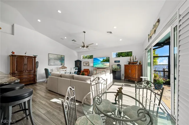 a living room with fireplace furniture and a flat screen tv