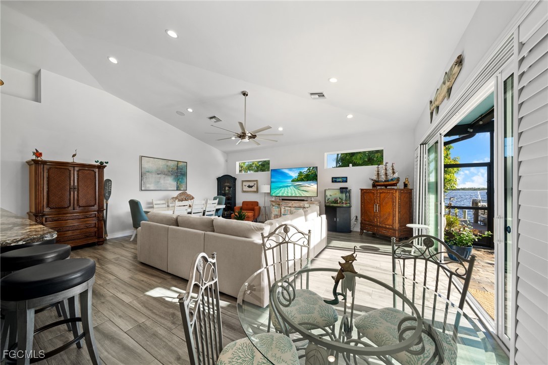 2743 Janet Street Matlacha, FL 33993 - Photo 9 of 45 a living room with fireplace furniture and a flat screen tv