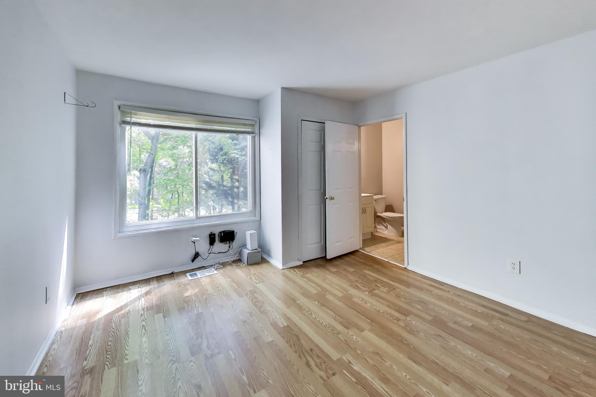 2225 Southgate Square Reston, VA 20191 - Photo 17 of 40 Large rear-facing bedroom with en-suite bath