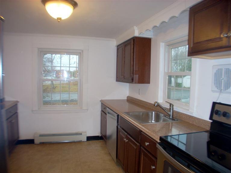6 Bacon Road Hyannis, MA 02601 - Photo 16 of 27 a kitchen with a sink stove and cabinets
