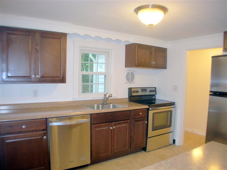 6 Bacon Road Hyannis, MA 02601 - Photo 2 of 27 a kitchen with stainless steel appliances granite countertop a sink stove and microwave