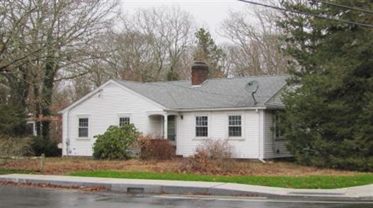 6 Bacon Road Hyannis, MA 02601 - Photo 27 of 27 a front view of a house with a yard and garage