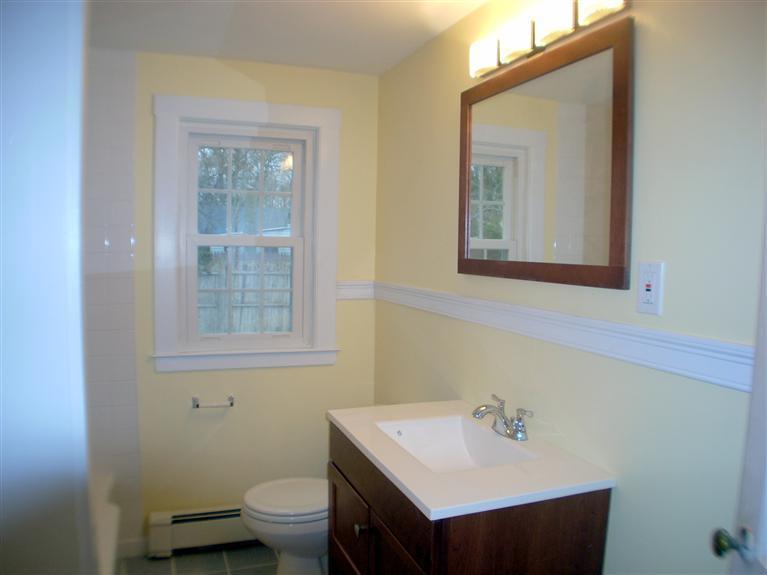 6 Bacon Road Hyannis, MA 02601 - Photo 9 of 27 a bathroom with a sink vanity mirror and toilet