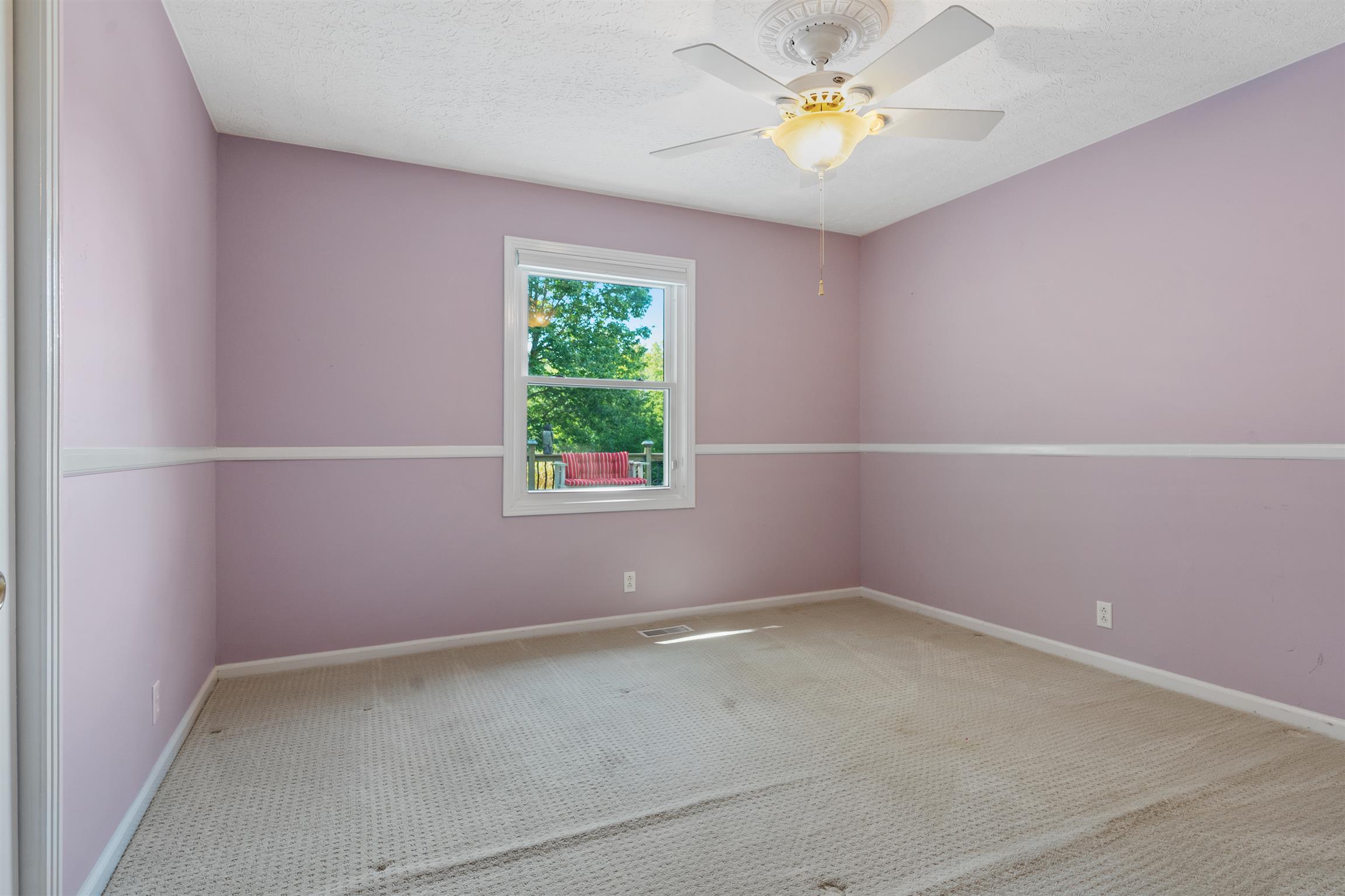 5338 New Chapel Road Springfield, TN 37172 - Photo 15 of 22 an empty room with a window and a fan