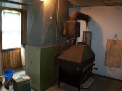 1065 Back Road Shapleigh, ME 04076 - Photo 8 of 13 Other. Woodstove in Basement