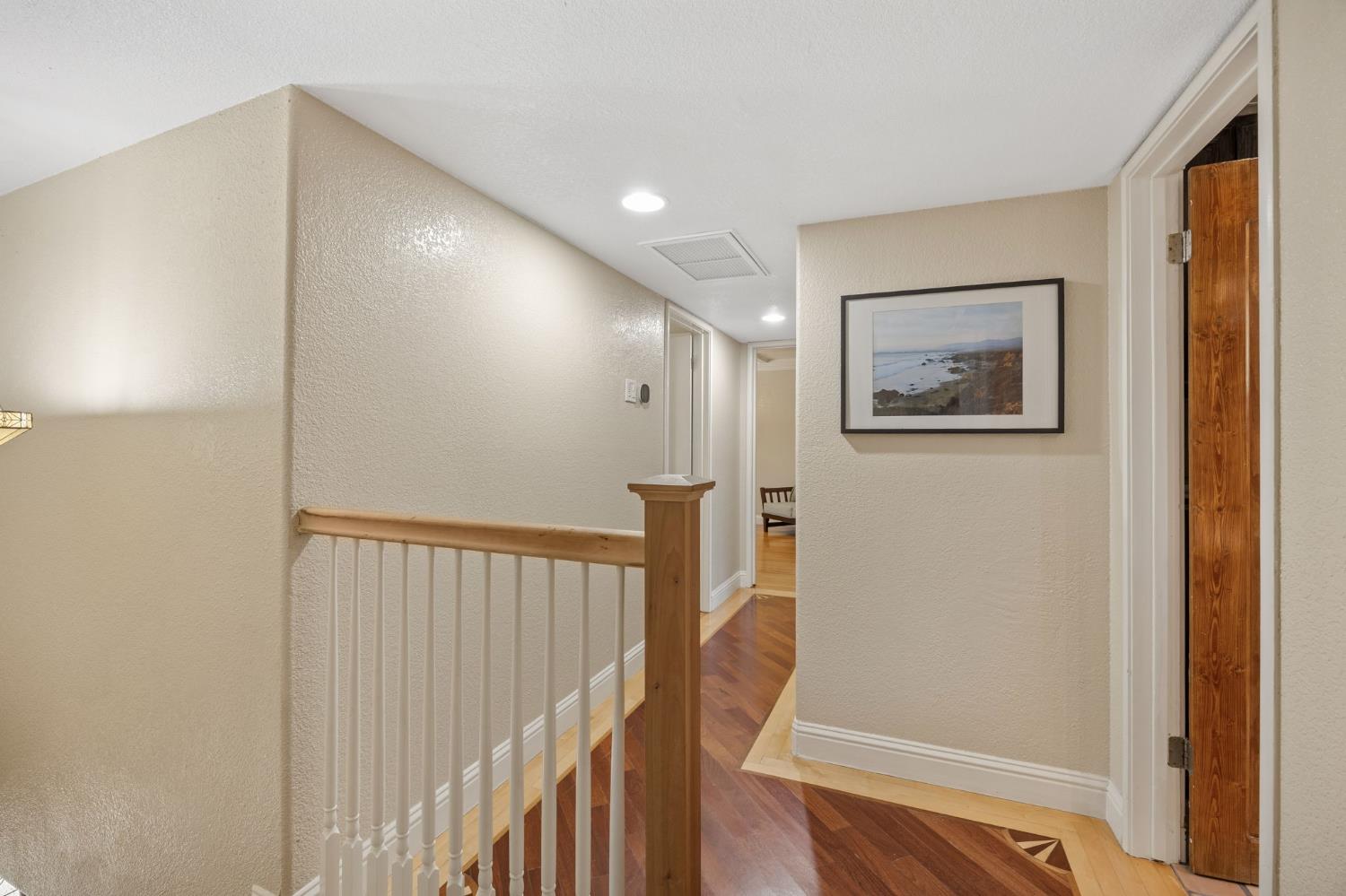 4206 Zephyr Way Sacramento, CA 95821 - Photo 24 of 45 a view of entryway with stairs and wooden floor