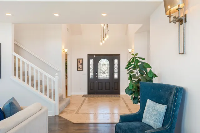 a living room with furniture fireplace and window