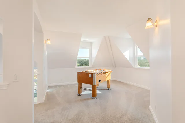 a bedroom with a bed and a night stand