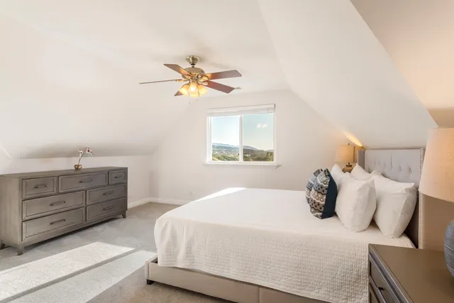 a bathroom with a granite countertop sink a mirror and a shower