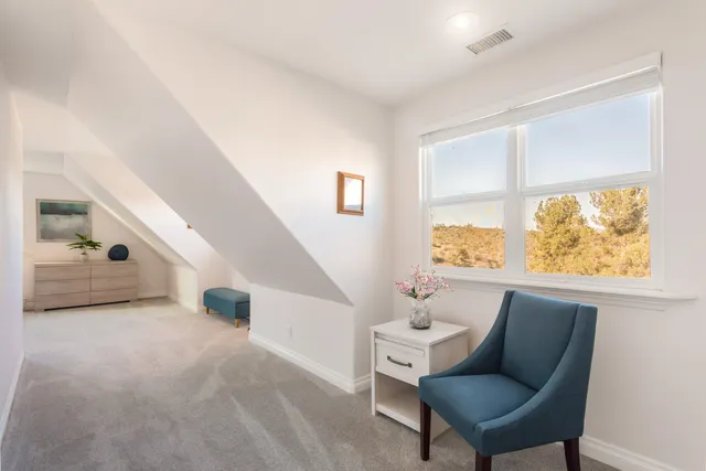 a view of swimming pool with seating space