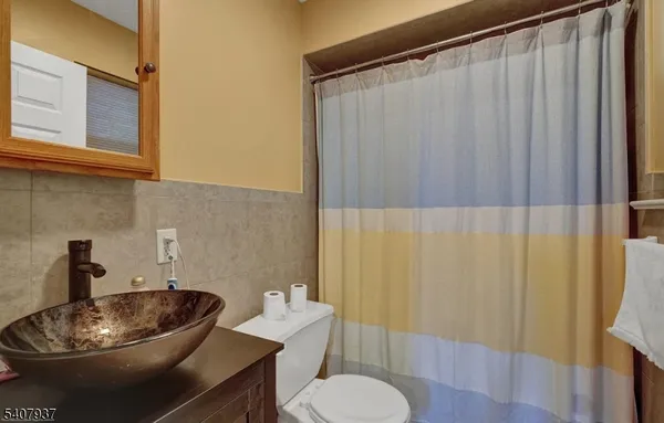 a bathroom with a sink and toilet