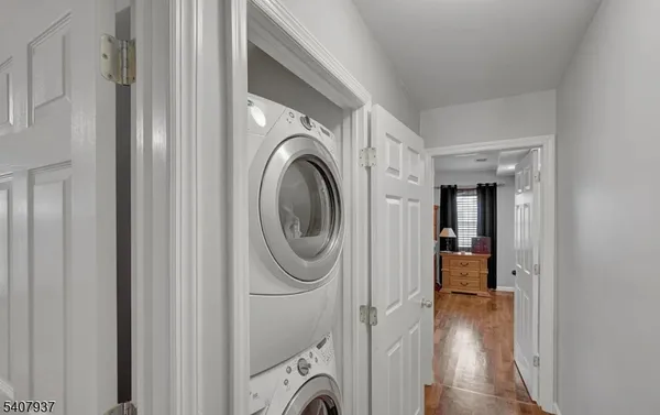 a view of a hallway with washer and dryer