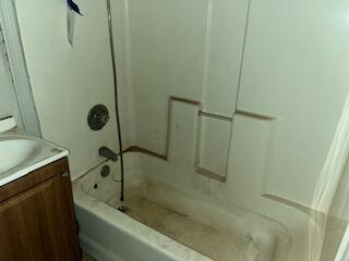 2106 35th Street Lubbock, TX 79412 - Photo 17 of 20 a bathroom with a bathtub