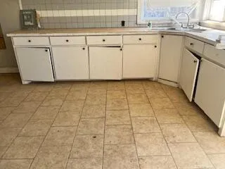 a view of a white refrigerator cabinets and a stove