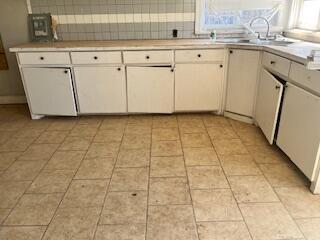 2106 35th Street Lubbock, TX 79412 - Photo 6 of 20 a view of a white refrigerator cabinets and a stove