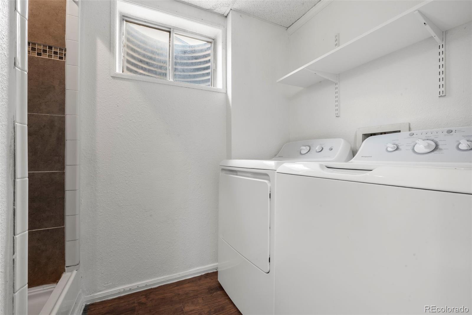 5167 Sable Street Denver, CO 80239 - Photo 17 of 27 a utility room with dryer and washer