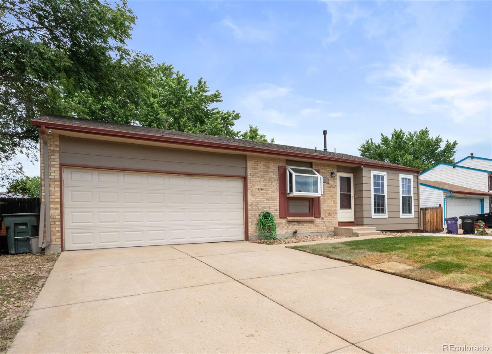 5167 Sable Street Denver, CO 80239 - Photo 2 of 27 a view of a yard in front of a house
