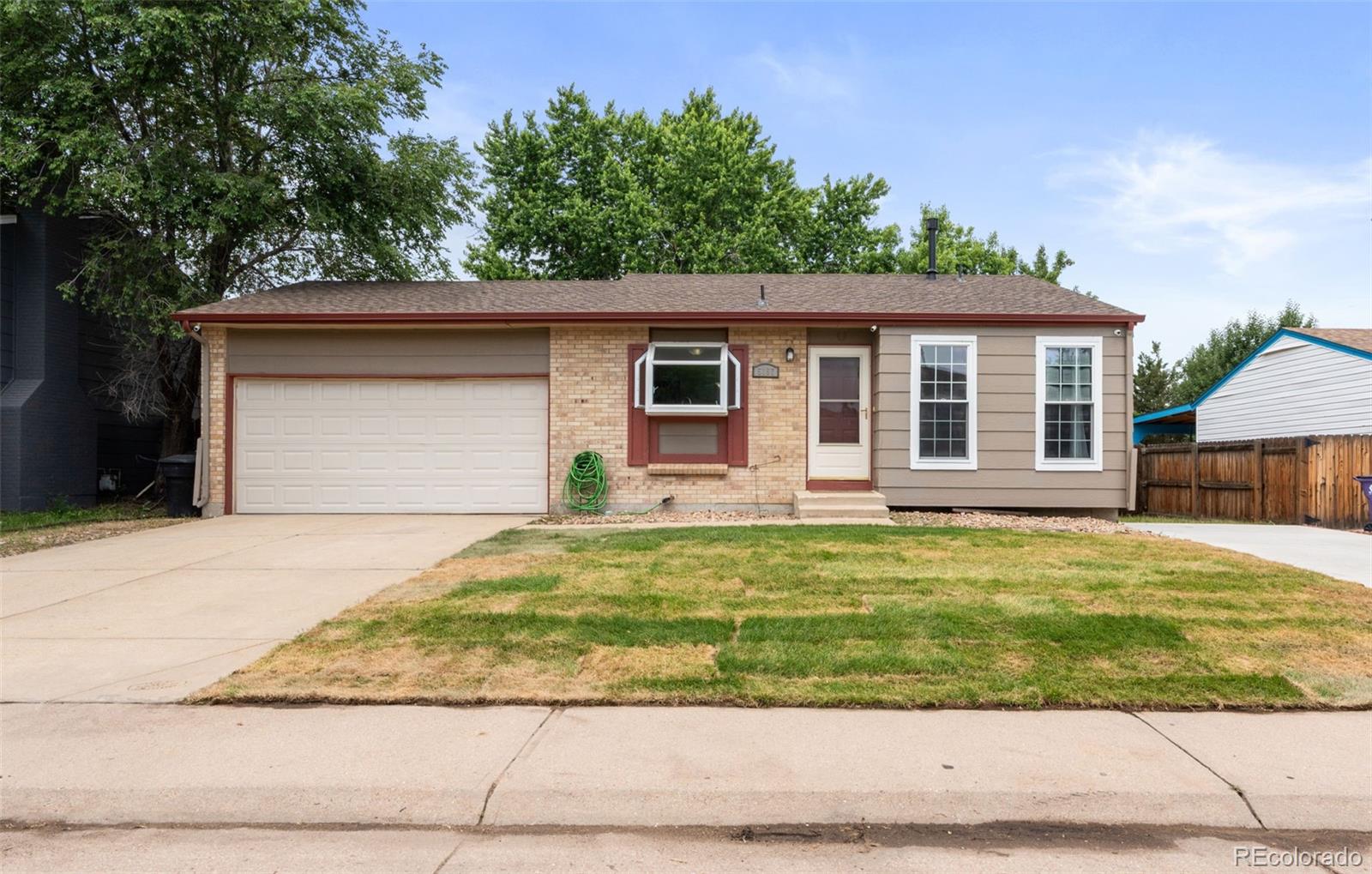 5167 Sable Street Denver, CO 80239 - Photo 3 of 27 a house view with a outdoor space