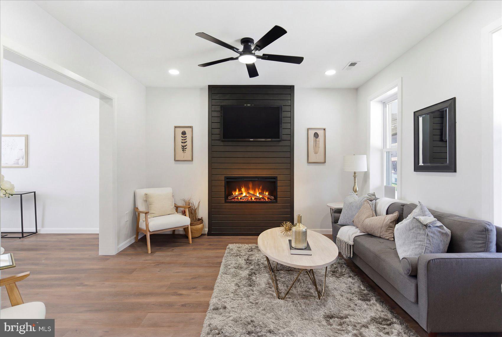 2009 Ruxton Avenue Baltimore, MD 21216 - Photo 2 of 37 a living room with furniture and a fireplace