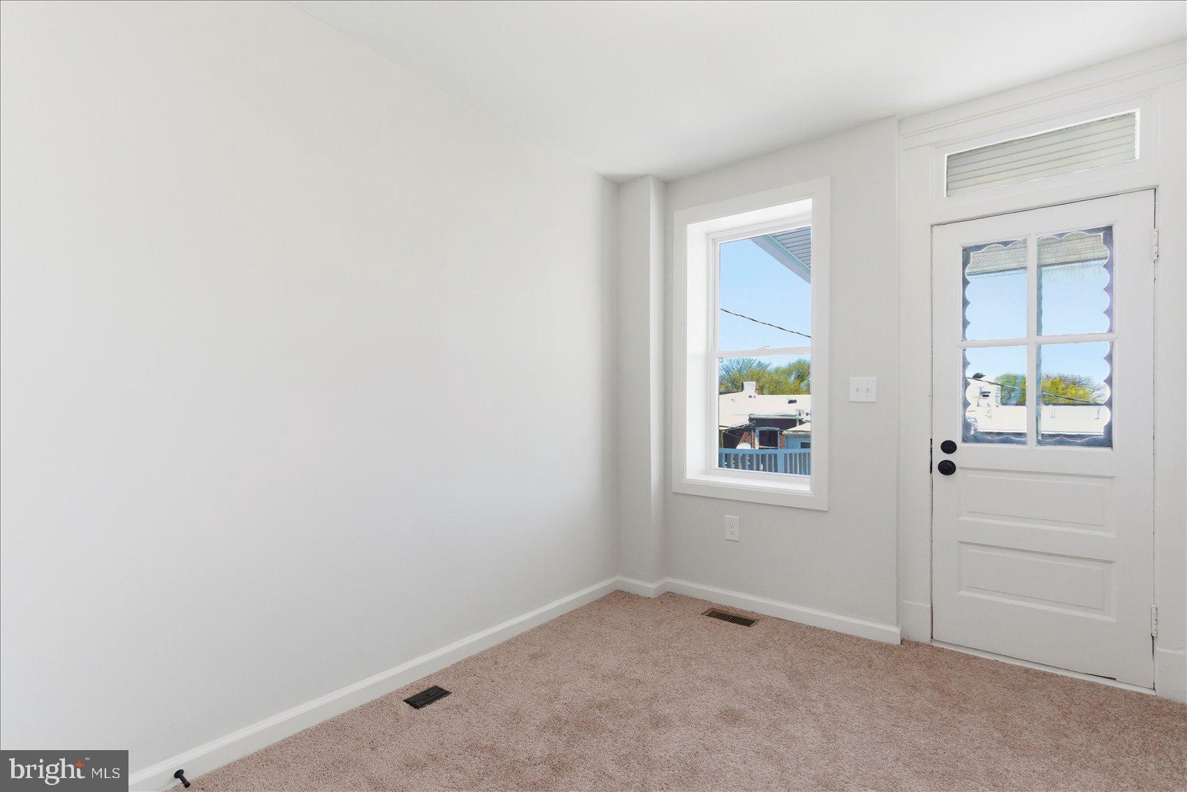 2009 Ruxton Avenue Baltimore, MD 21216 - Photo 24 of 37 an empty room with windows