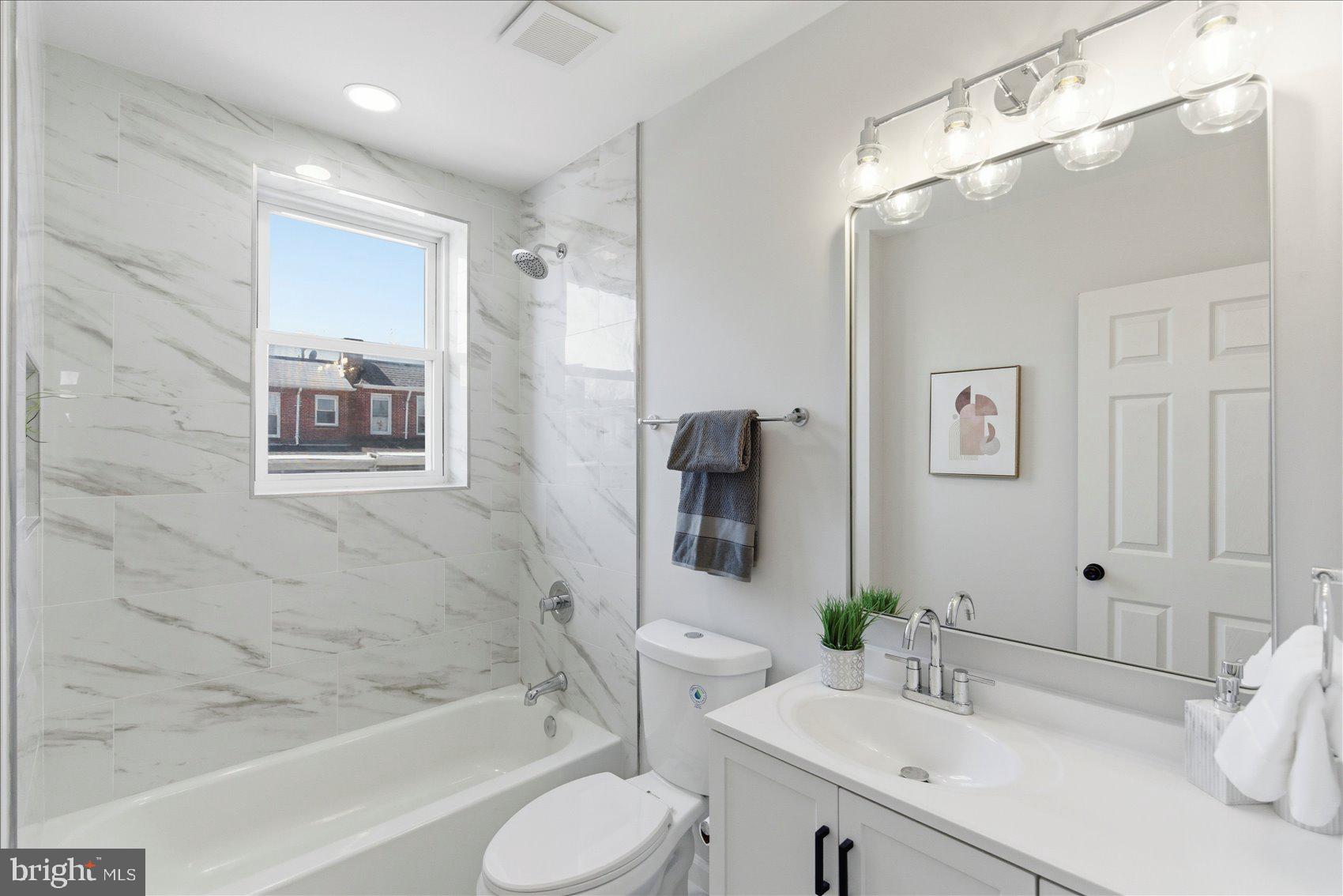 2009 Ruxton Avenue Baltimore, MD 21216 - Photo 26 of 37 a bathroom with a sink toilet and shower