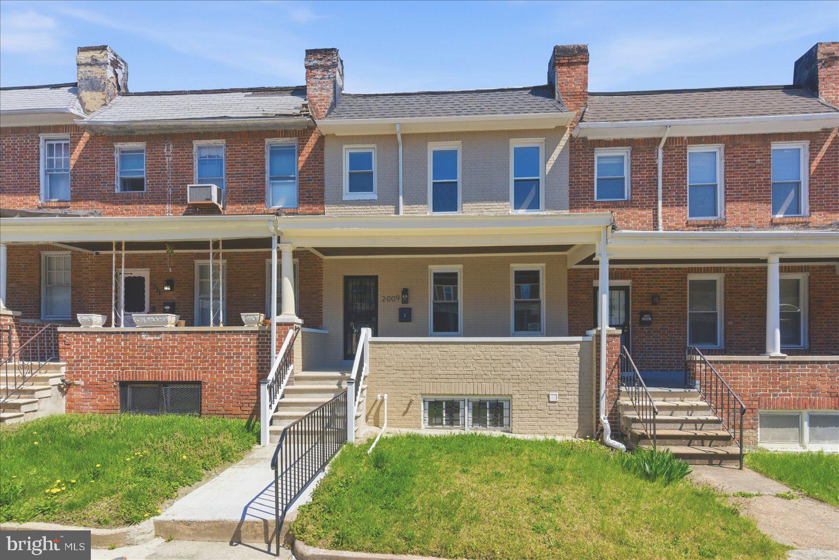 2009 Ruxton Avenue Baltimore, MD 21216 - Photo 32 of 37 a front view of a house with a yard