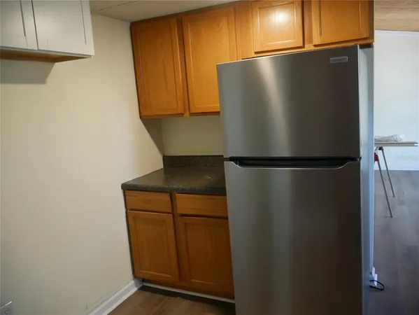 a view of a refrigerator in kitchen
