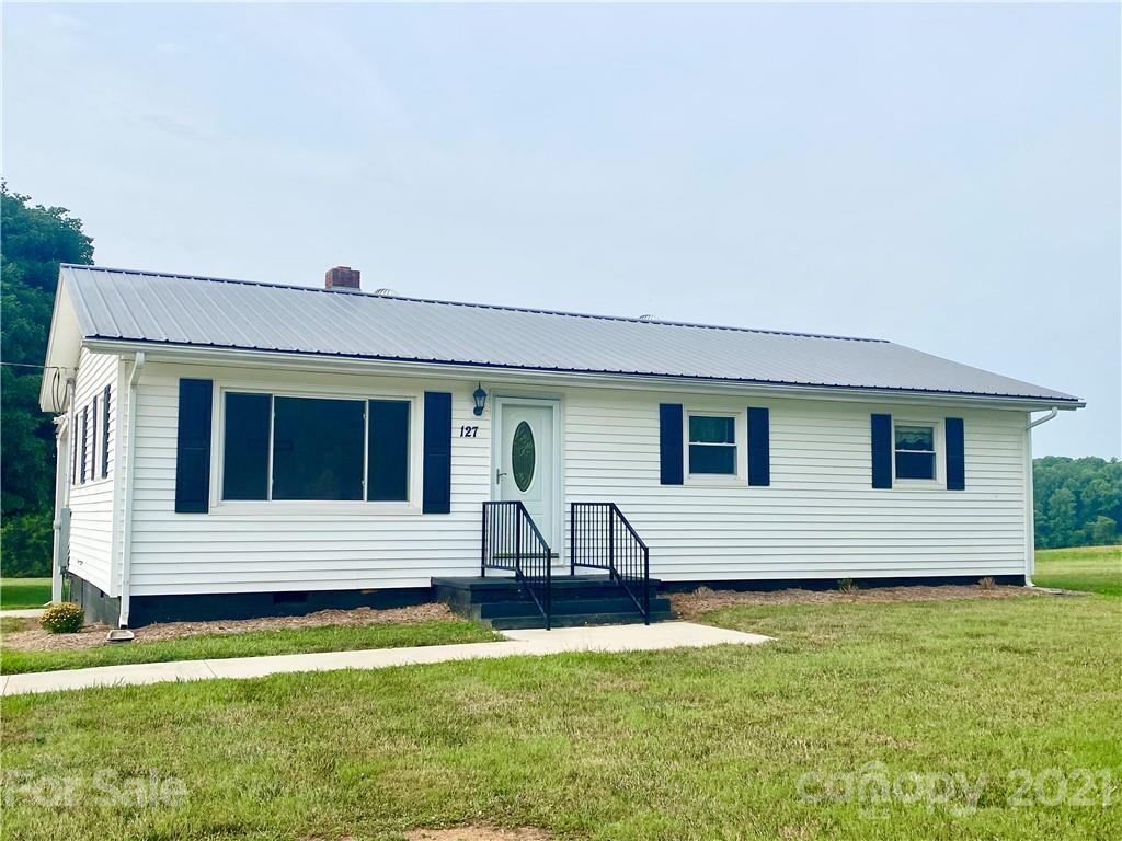 127 Countryside Road Harmony, NC 28634 - Photo 2 of 27 a front view of house with yard