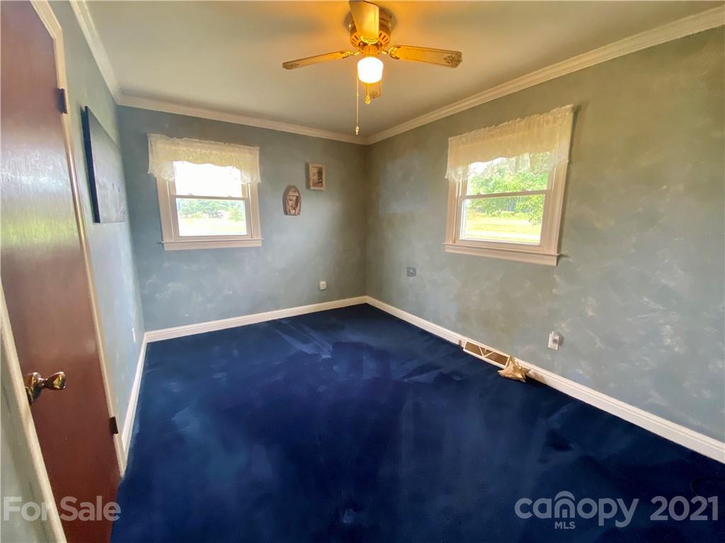 127 Countryside Road Harmony, NC 28634 - Photo 13 of 27 a view of an empty room with a window