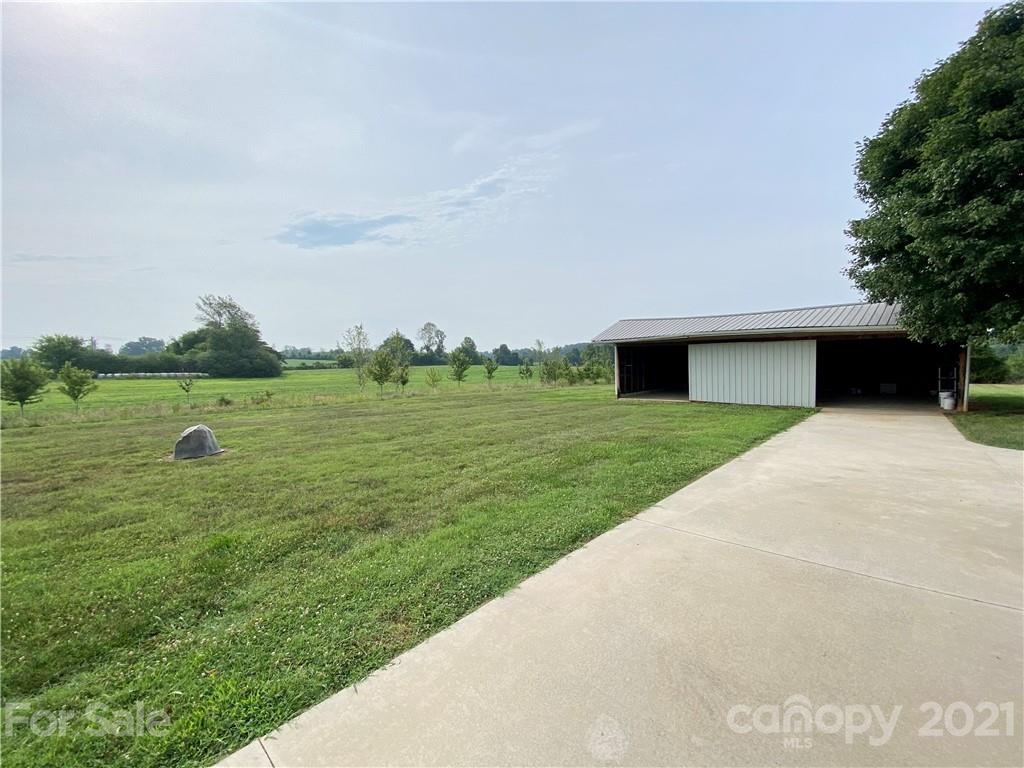 127 Countryside Road Harmony, NC 28634 - Photo 19 of 27 a front view of a house with a yard